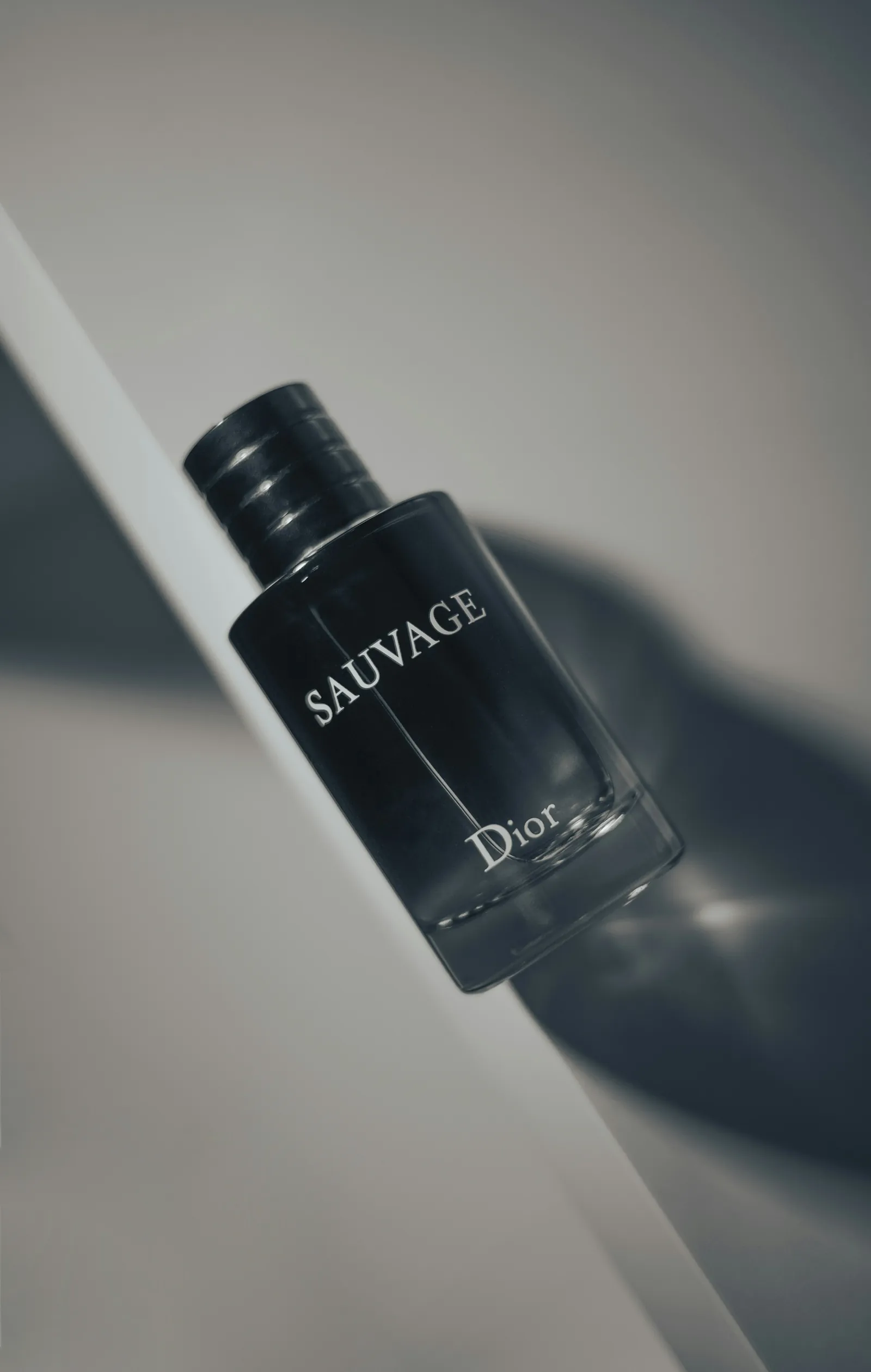 Dior Sauvage on a white plinth in hard light